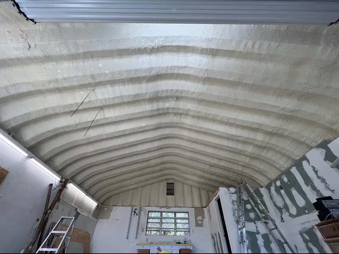 Spray polyurethane foam applied to the underside of a metal roof deck in Abingdon
